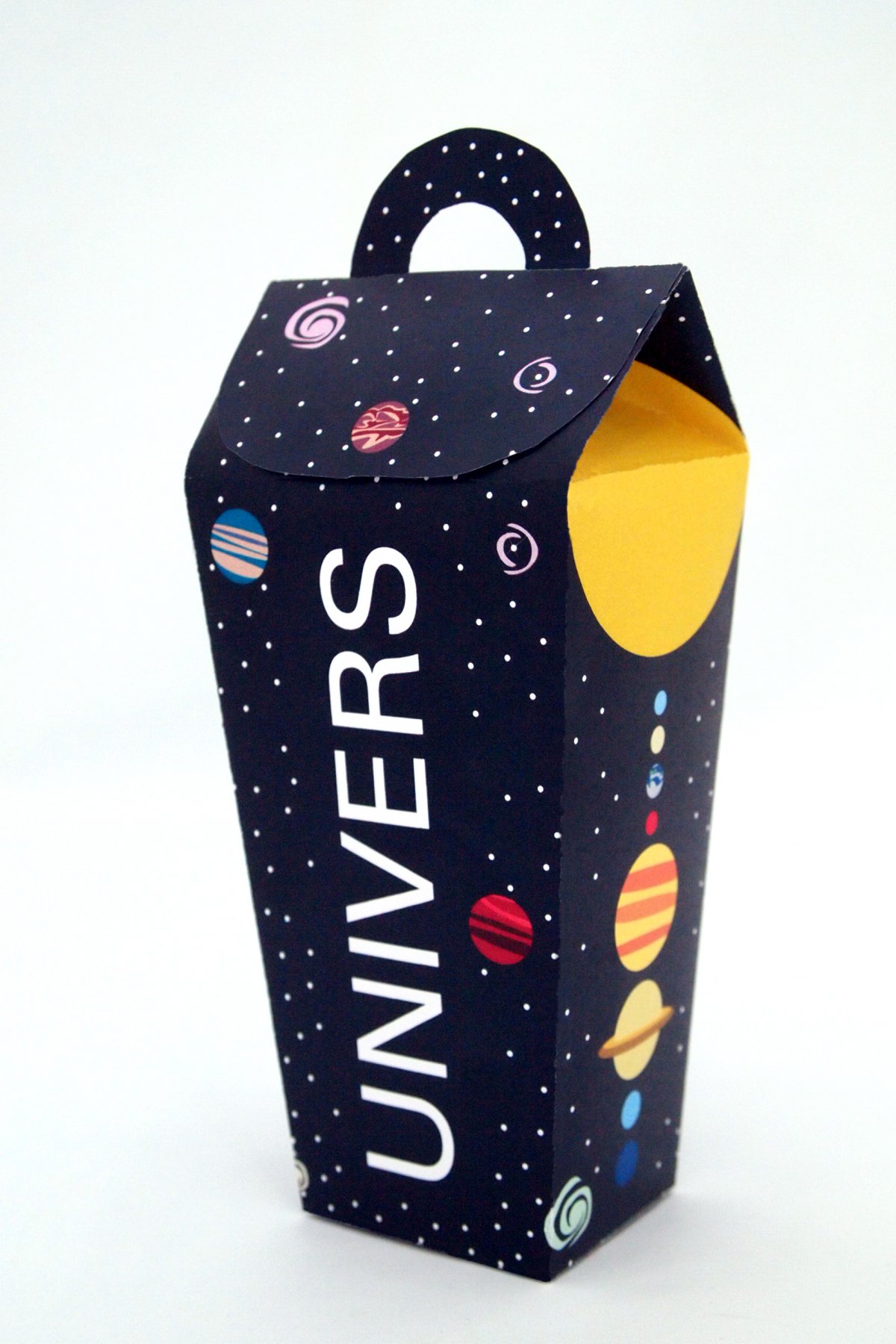 A corner shot of the front of the package and the right side showing an illustration of the solar system.